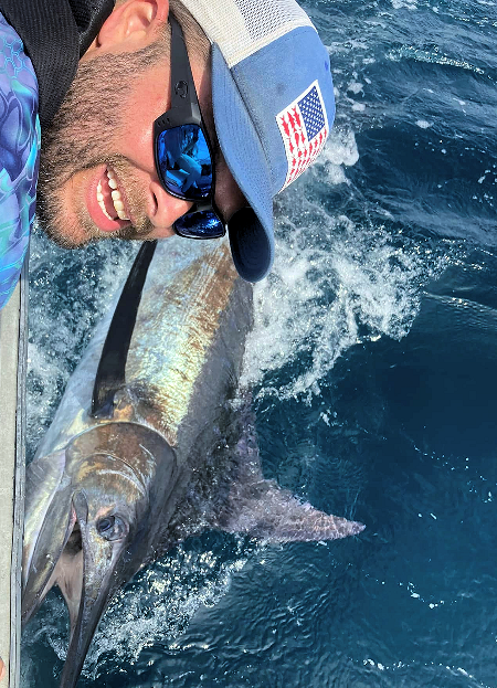 Angler releasing blue marlin on an Outer Banks charter trip.