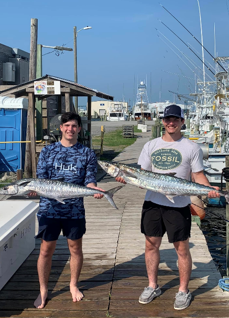 Two young Wanchese Marina anglers show off the wahoos they caught on a charter trip.